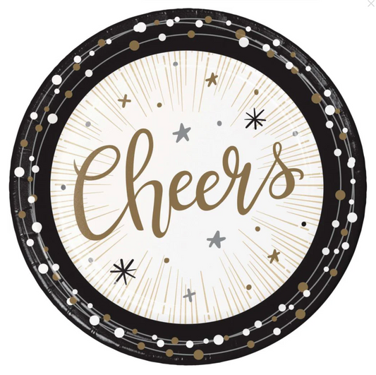 Round black and white luncheon plate with gold script "Cheers" and starburst design, decorated with gold, silver, and black.