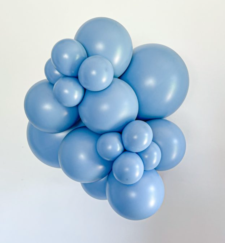 Cluster of light blue latex balloons in various sizes forming a decorative arrangement.