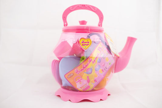 Pink plastic teapot with heart-shaped handle and scalloped base, featuring colorful tea party-themed stickers.
