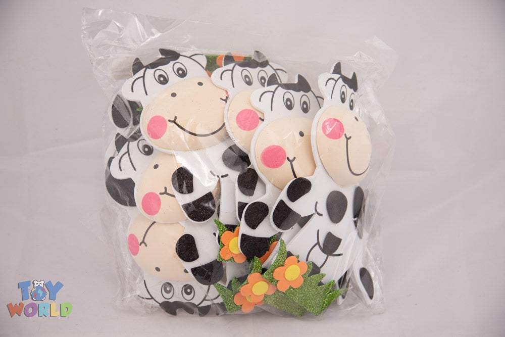 Set of three plush black and white spotted cows with pink cheeks made from soft EVA foam.