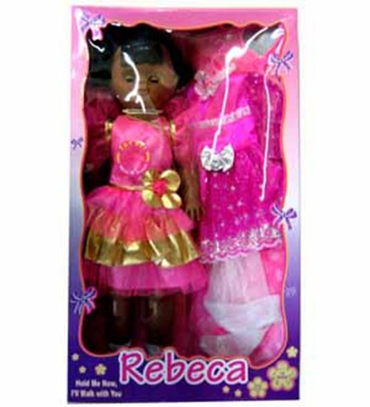 Dark-skinned doll with black hair wearing pink and gold dress, packaged with a sparkly pink outfit and white shoes in a pink .