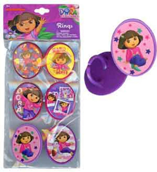 Set of six colorful plastic cupcake topper rings featuring Dora the Explorer with pink, purple, yellow, and red backgrounds.