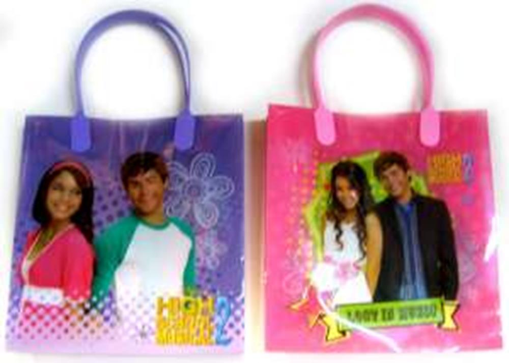 Two small rectangular gift bags with rounded handles; one purple with a girl and boy and flower designs, the other pink with