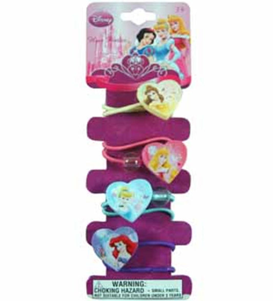 Four colorful hair clips with heart-shaped Disney princess designs featuring Belle, Aurora, Cinderella, and Ariel on a pink.