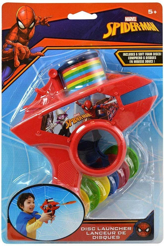 Red plastic Spiderman-themed foam disc launcher with a circular chamber and colorful foam discs, packaged on a.