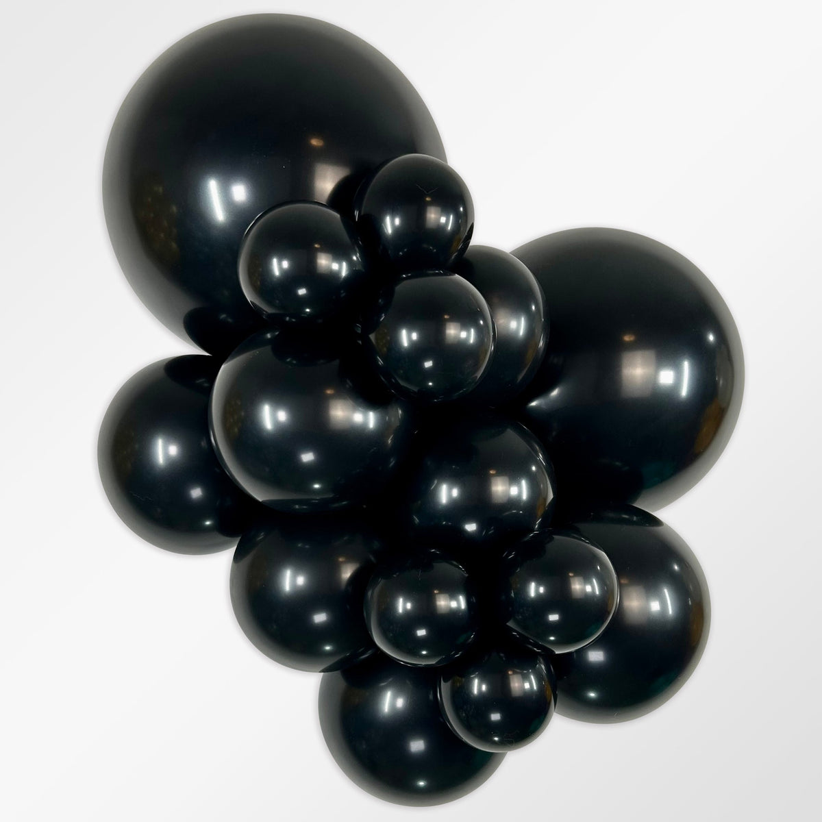 Sempertex Deluxe Black latex balloon color cluster showing the shade across multiple balloon sizes