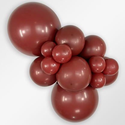 Sempertex Deluxe Merlot latex balloon color cluster showing the shade across multiple balloon sizes