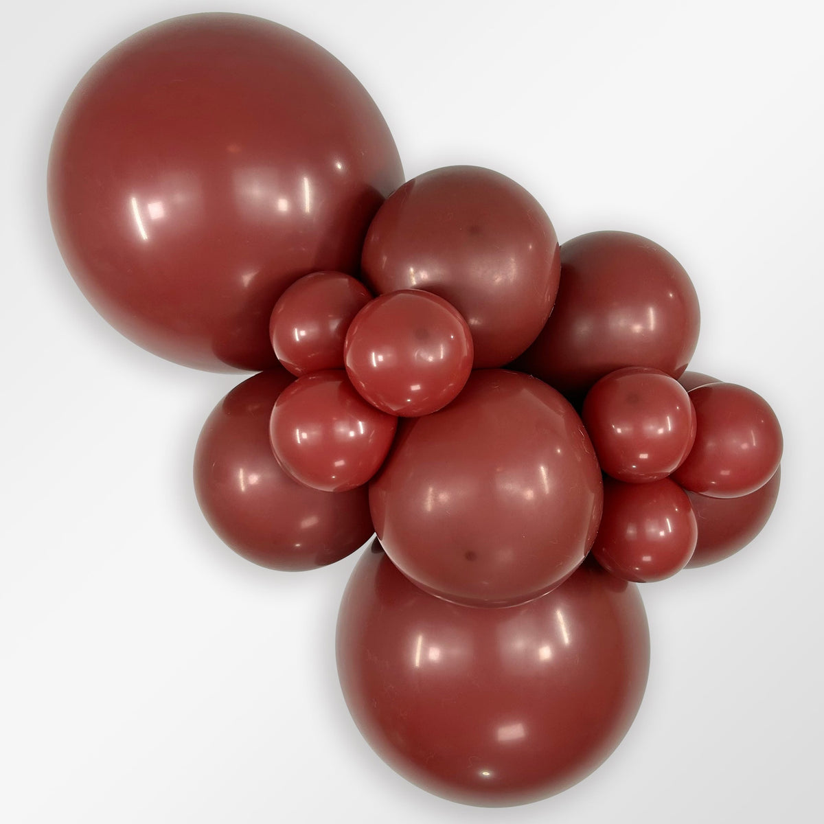 Sempertex Deluxe Merlot latex balloon color cluster showing the shade across multiple balloon sizes