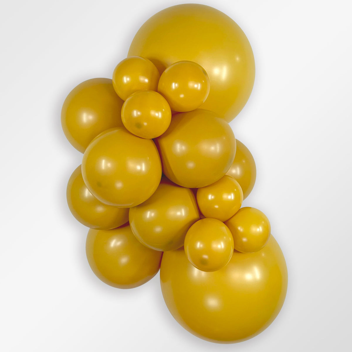 Sempertex Deluxe Mustard latex balloon color cluster showing the shade across multiple balloon sizes