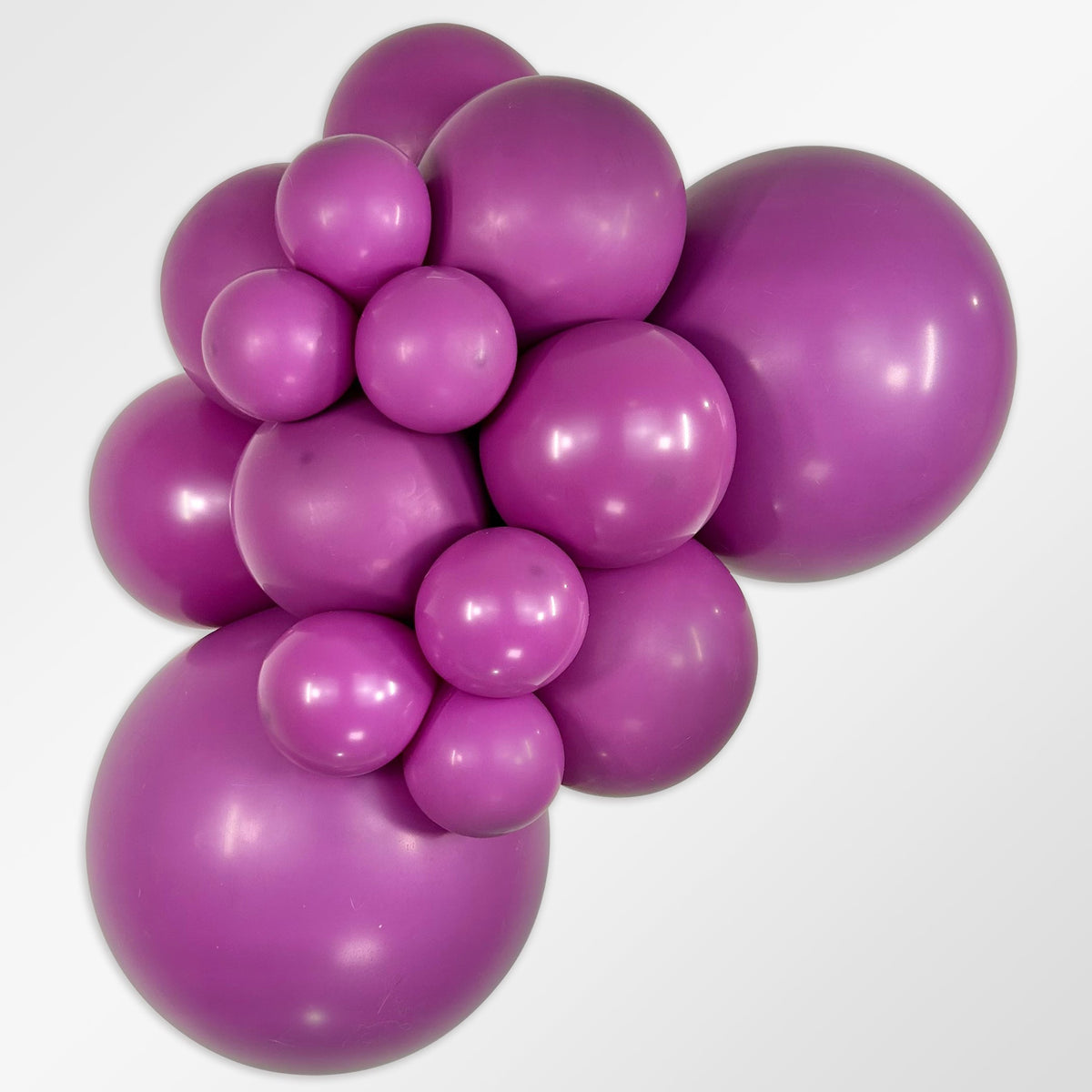 Sempertex Deluxe Purple Orchid latex balloon color cluster showing the shade across multiple balloon sizes