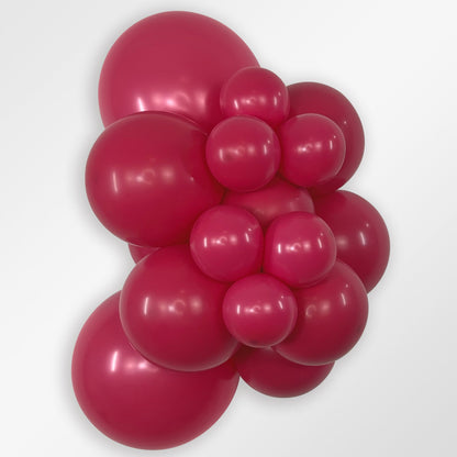 Sempertex Deluxe Raspberry latex balloon color cluster showing the shade across multiple balloon sizes