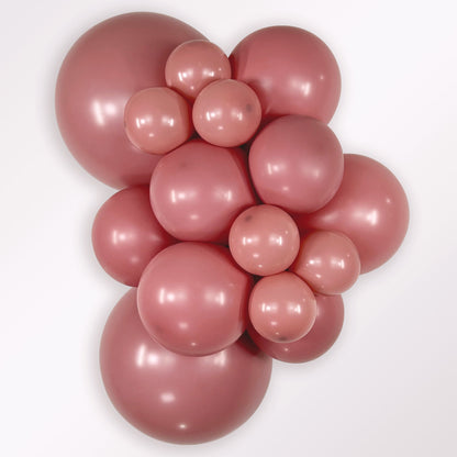 Sempertex Deluxe Rosewood latex balloon color cluster showing the shade across multiple balloon sizes