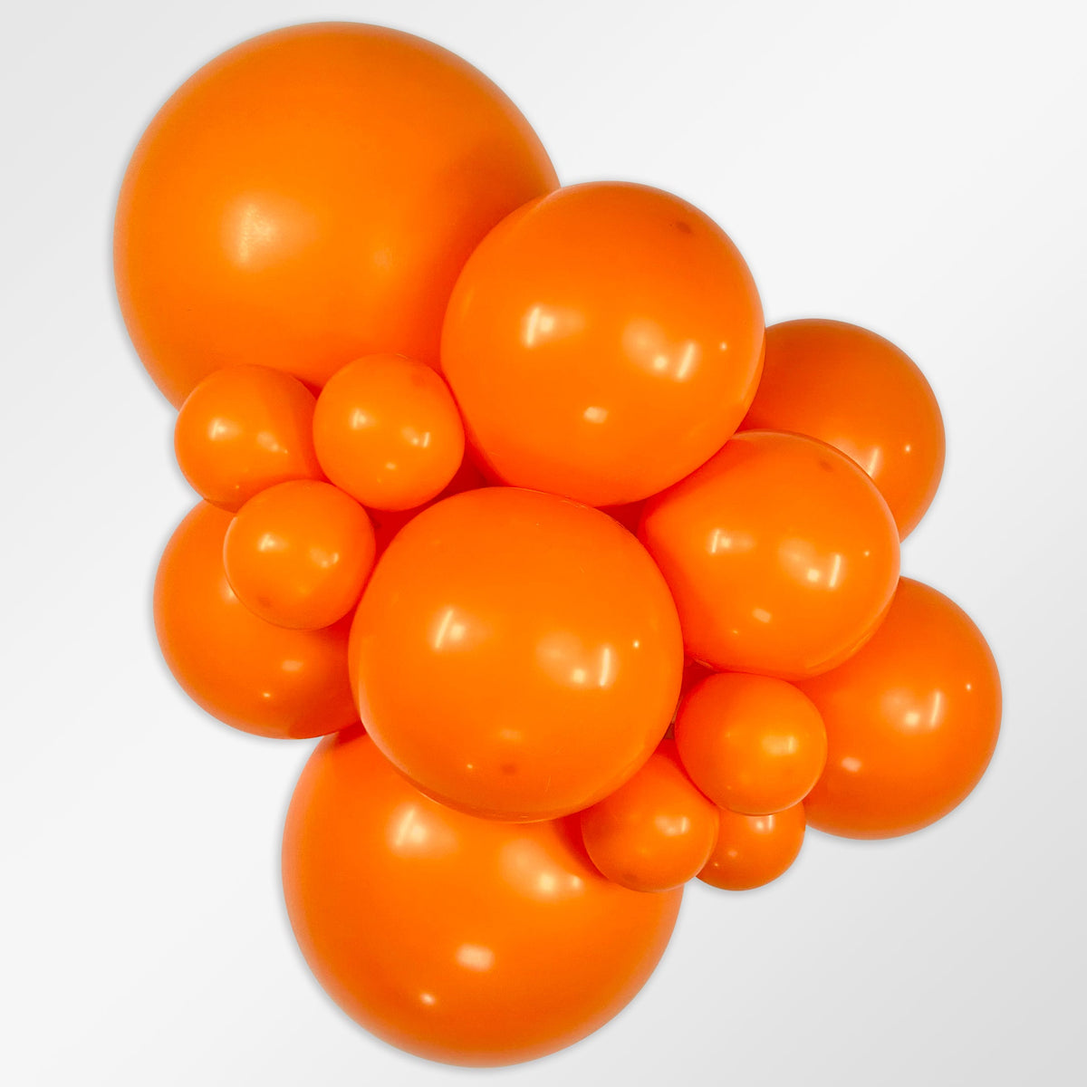 Sempertex Fashion Orange latex balloon color cluster showing the shade across multiple balloon sizes