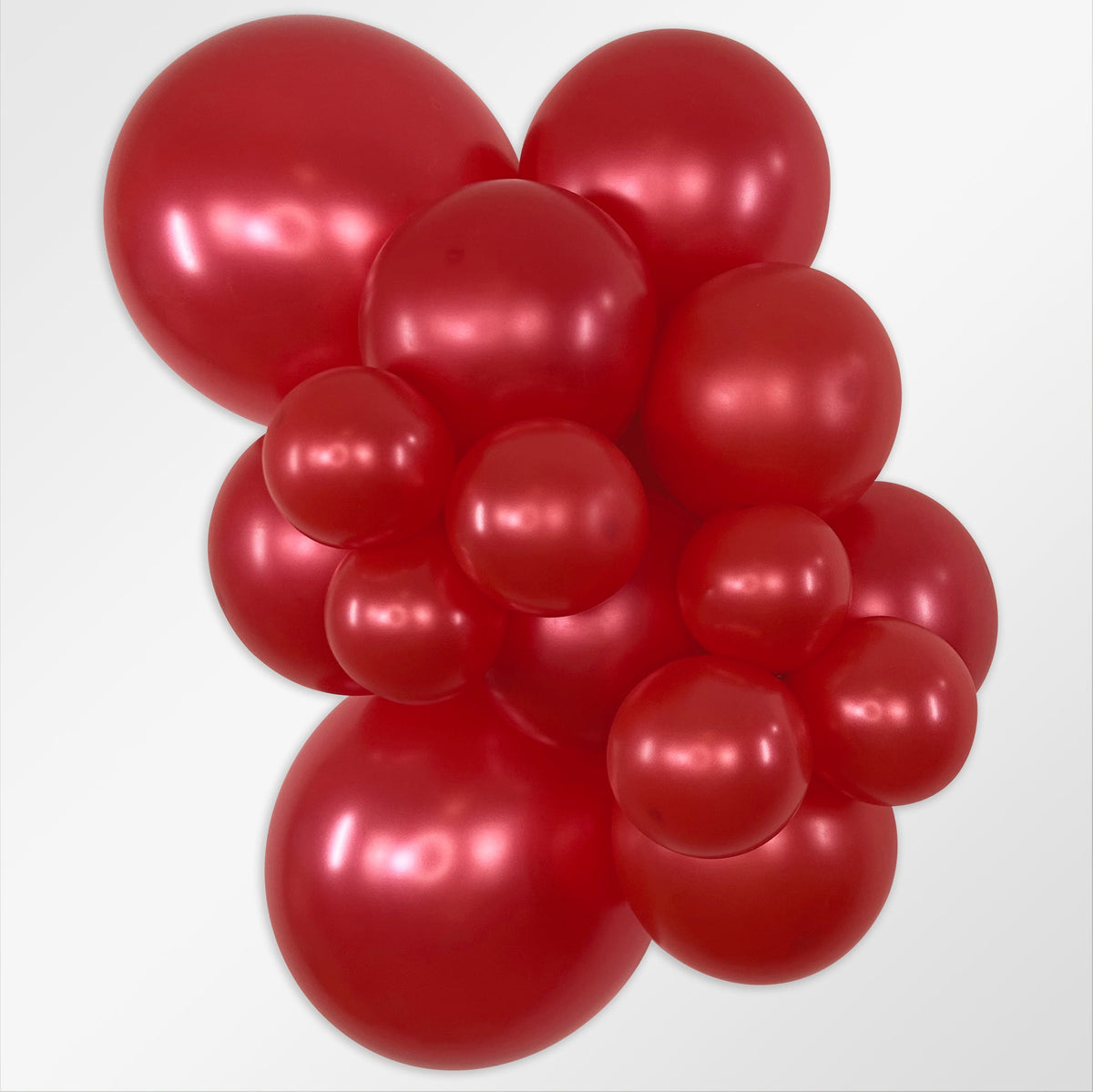 Sempertex Metallic Red latex balloon color cluster showing the shade across multiple balloon sizes