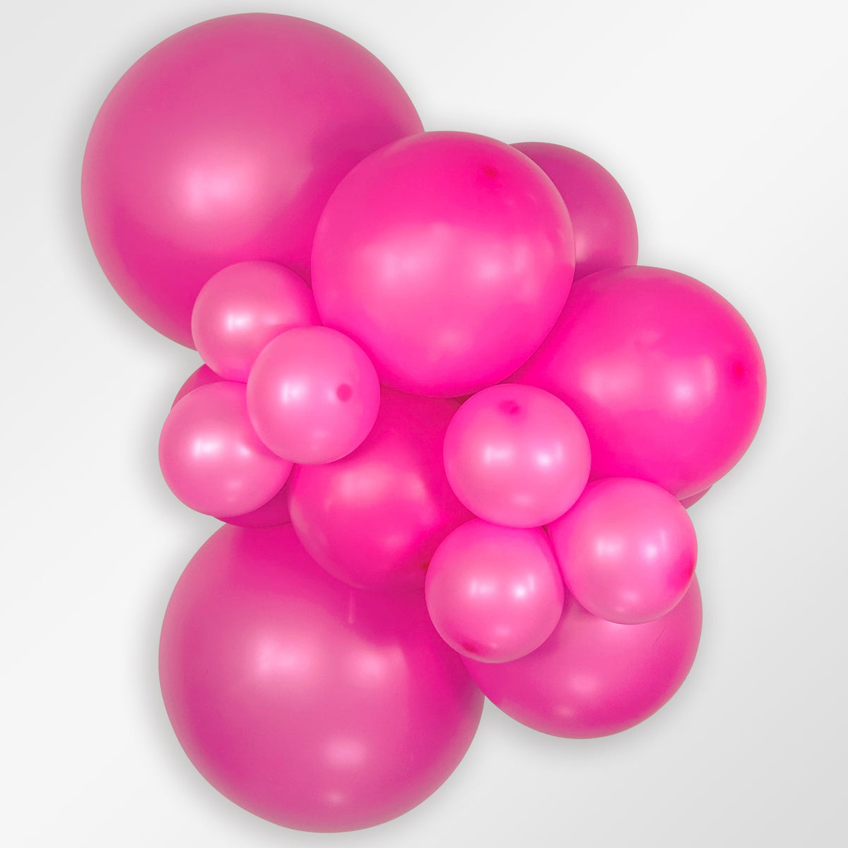 Sempertex Neon Magenta latex balloon color cluster showing the shade across multiple balloon sizes