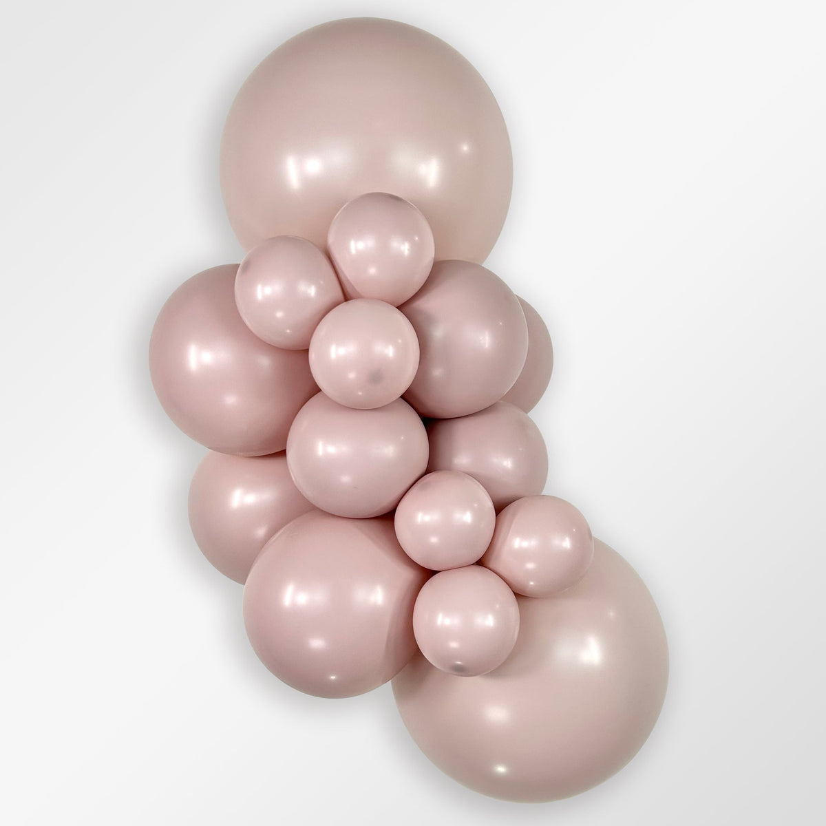 Sempertex Pastel Dusk Rose latex balloon color cluster showing the shade across multiple balloon sizes