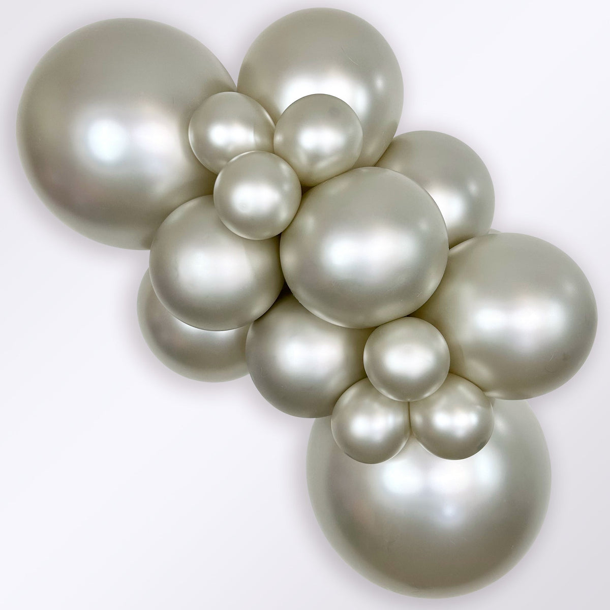 Sempertex Silk Cream Pearl latex balloon color cluster showing the shade across multiple balloon sizes