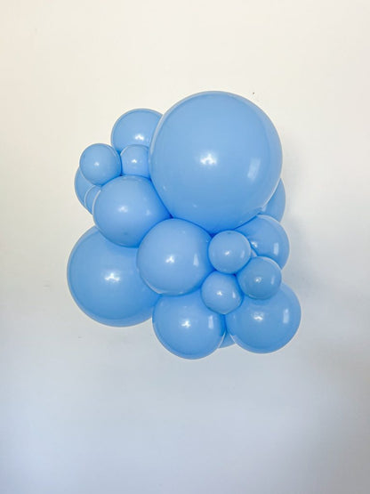 Tuftex Baby Blue latex balloon color cluster showing the shade across multiple balloon sizes