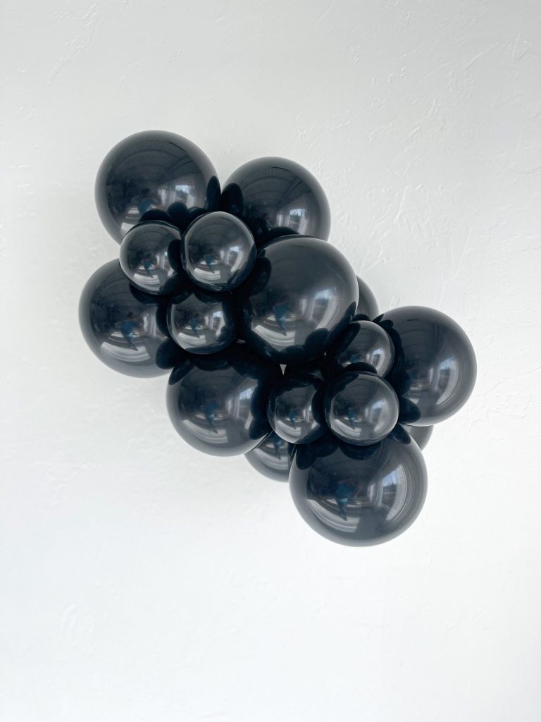 Tuftex Black latex balloon color cluster showing the shade across multiple balloon sizes