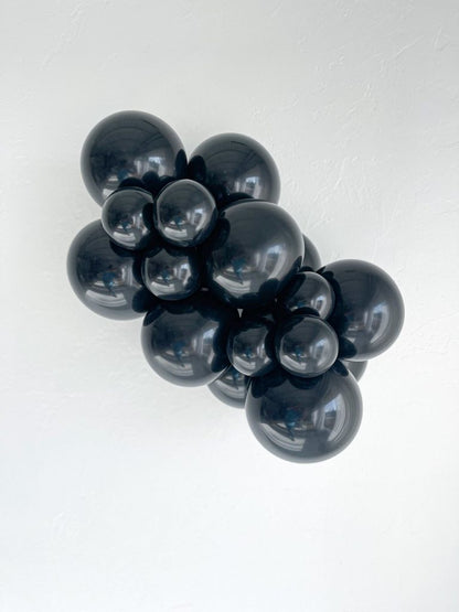 Tuftex Black latex balloon color cluster showing the shade across multiple balloon sizes