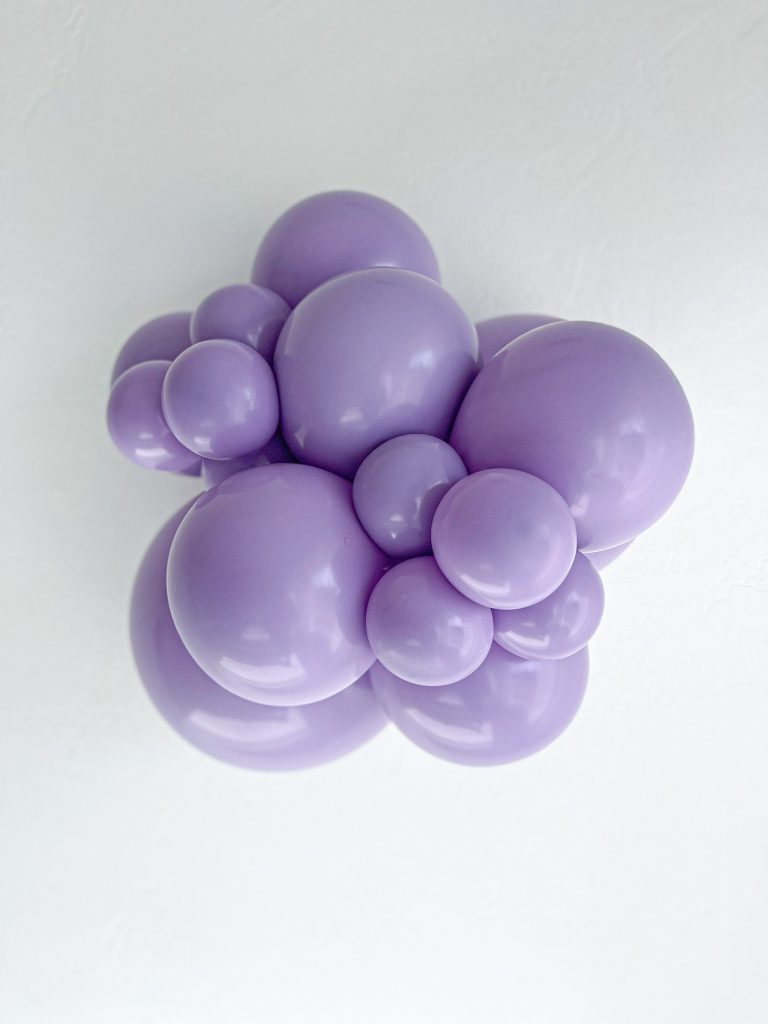Tuftex Blossom latex balloon color cluster showing the shade across multiple balloon sizes