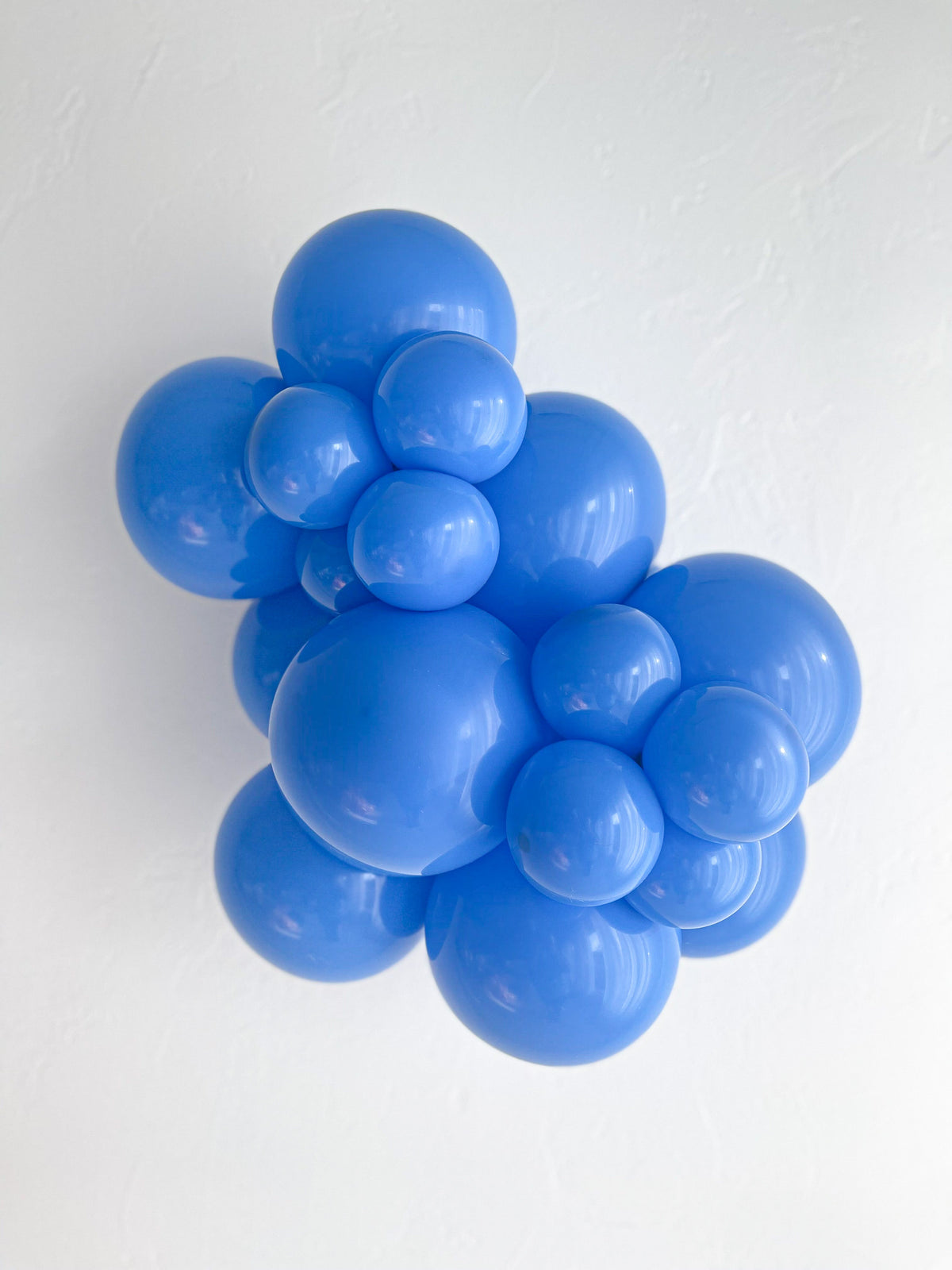 Tuftex Blue latex balloon color cluster showing the shade across multiple balloon sizes