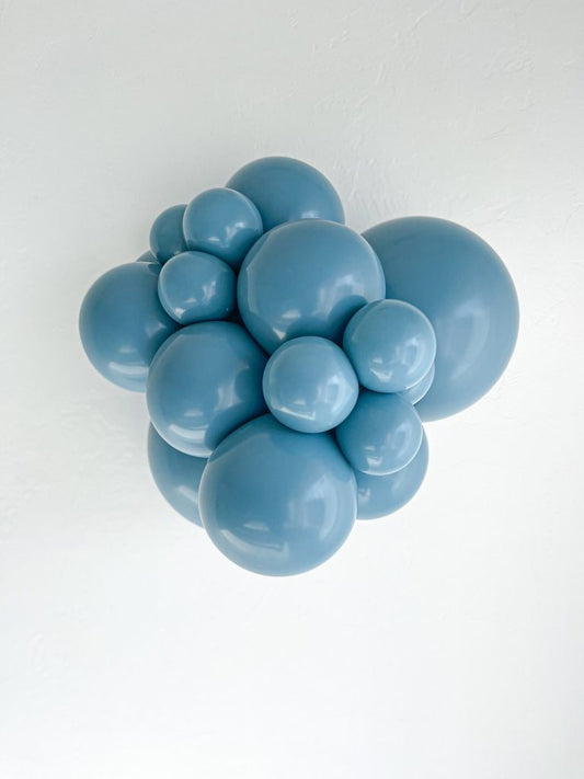Tuftex Blue Slate latex balloon color cluster showing the shade across multiple balloon sizes