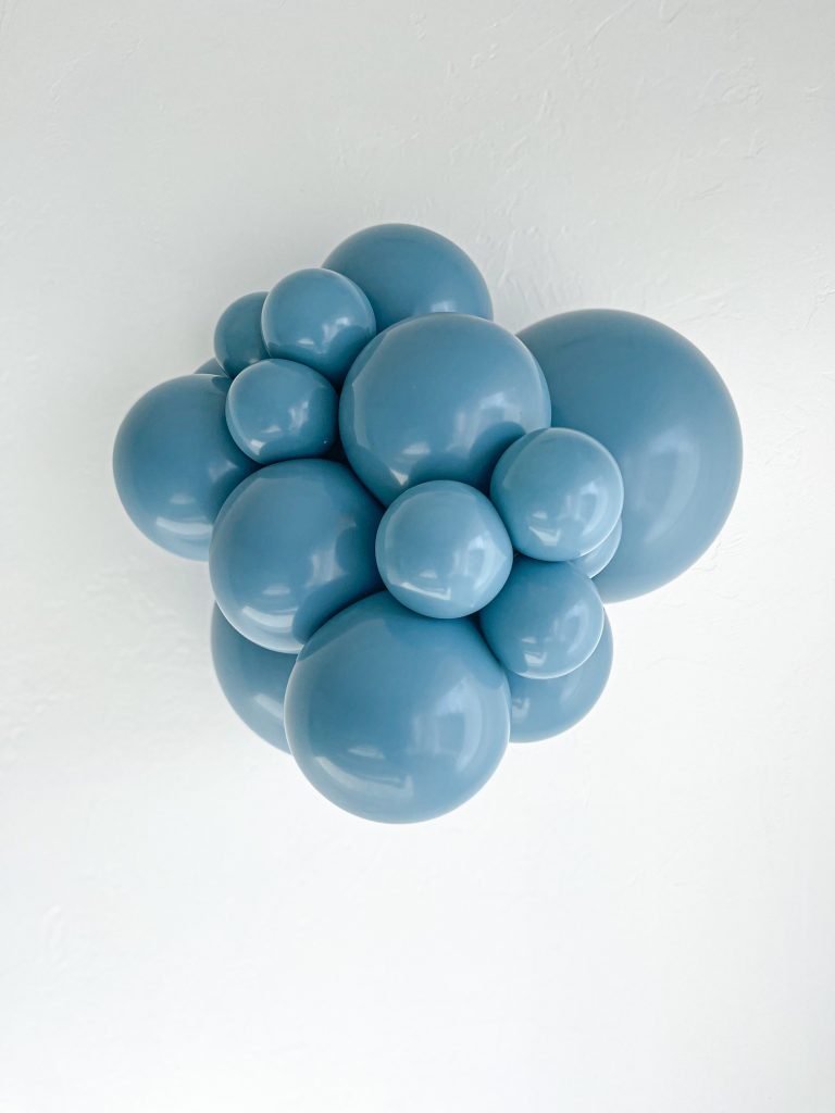 Tuftex Blue Slate latex balloon color cluster showing the shade across multiple balloon sizes