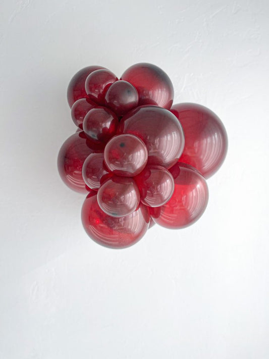 Tuftex Burgundy latex balloon color cluster showing the shade across multiple balloon sizes