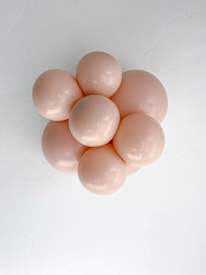 Tuftex Cameo latex balloon color cluster showing the shade across multiple balloon sizes