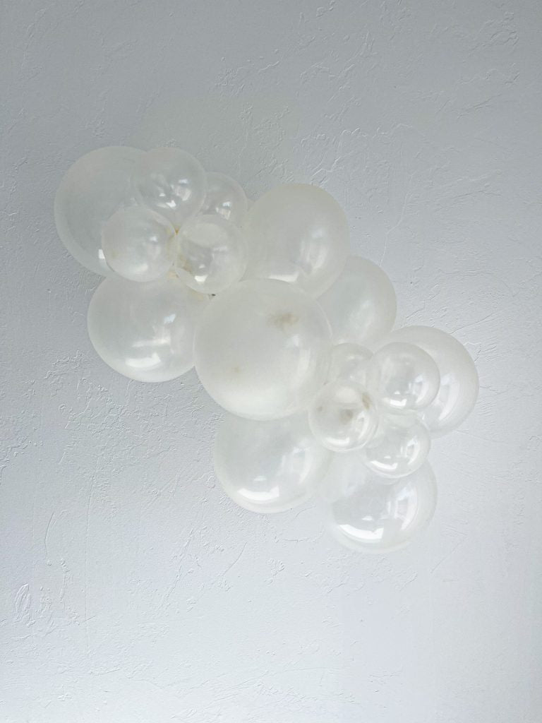 Tuftex Clear latex balloon color cluster showing the shade across multiple balloon sizes
