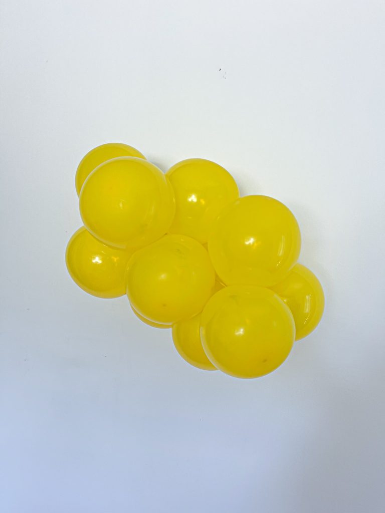 Tuftex Clear Yellow latex balloon color cluster showing the shade across multiple balloon sizes