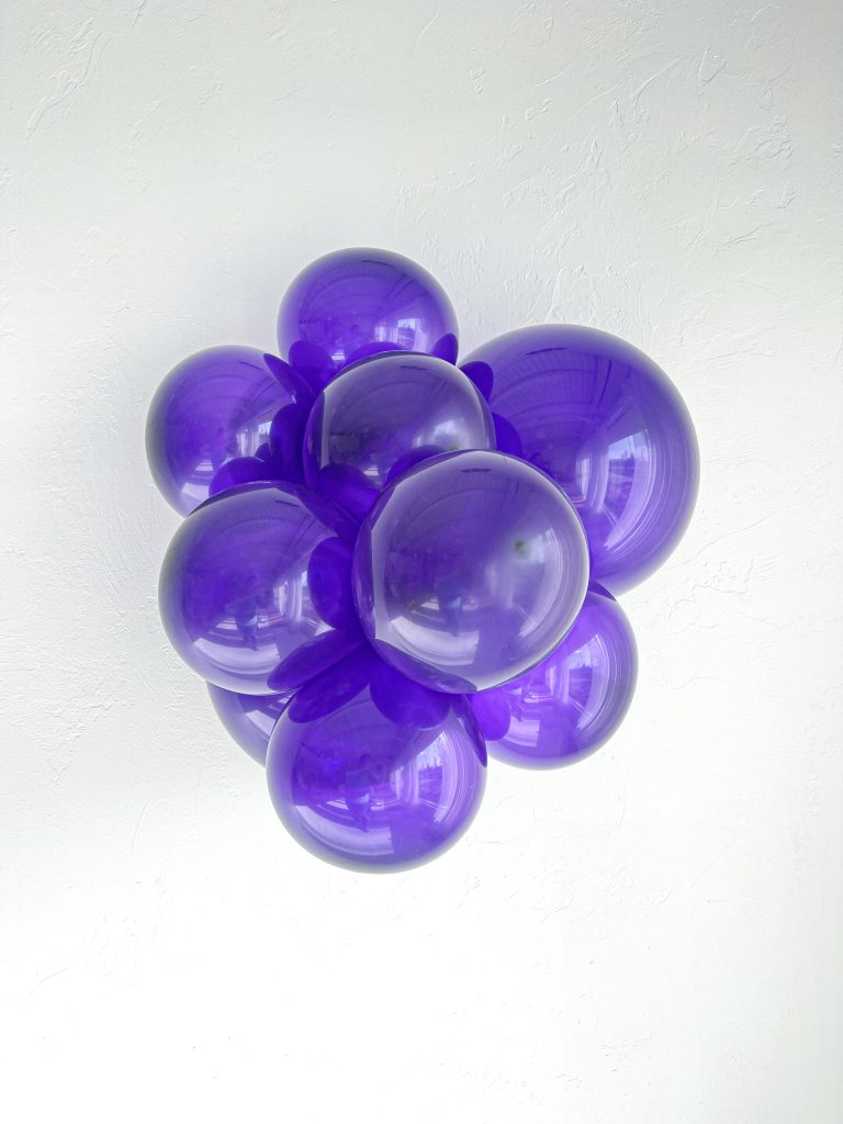 Tuftex Purple latex balloon color cluster showing the shade across multiple balloon sizes