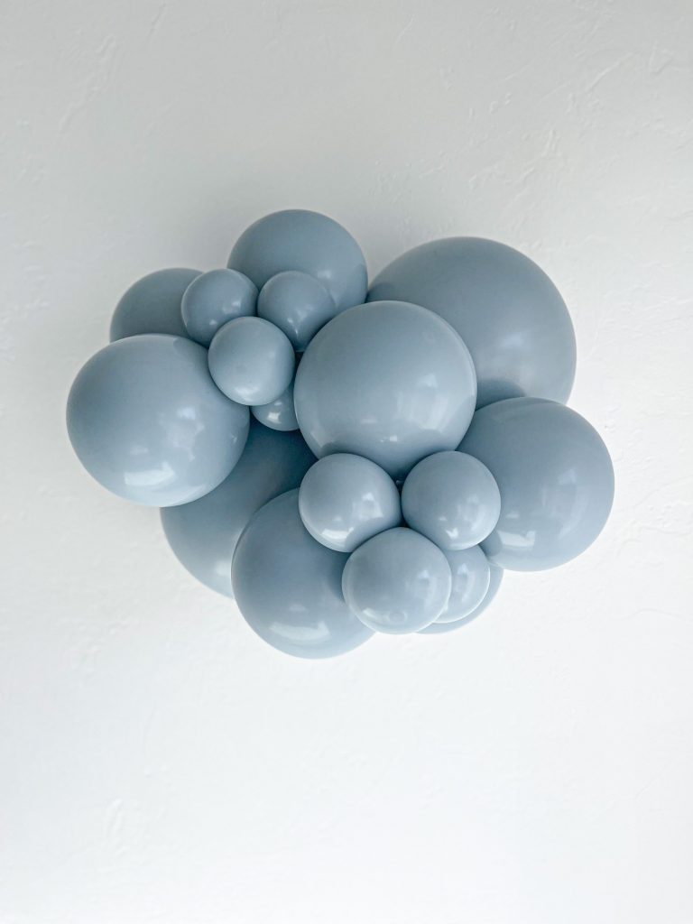 Tuftex Fog latex balloon color cluster showing the shade across multiple balloon sizes
