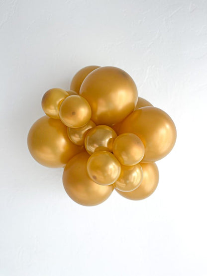 Tuftex Metallic Gold latex balloon color cluster showing the shade across multiple balloon sizes