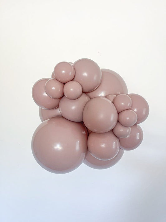 Tuftex Malted latex balloon color cluster showing the shade across multiple balloon sizes