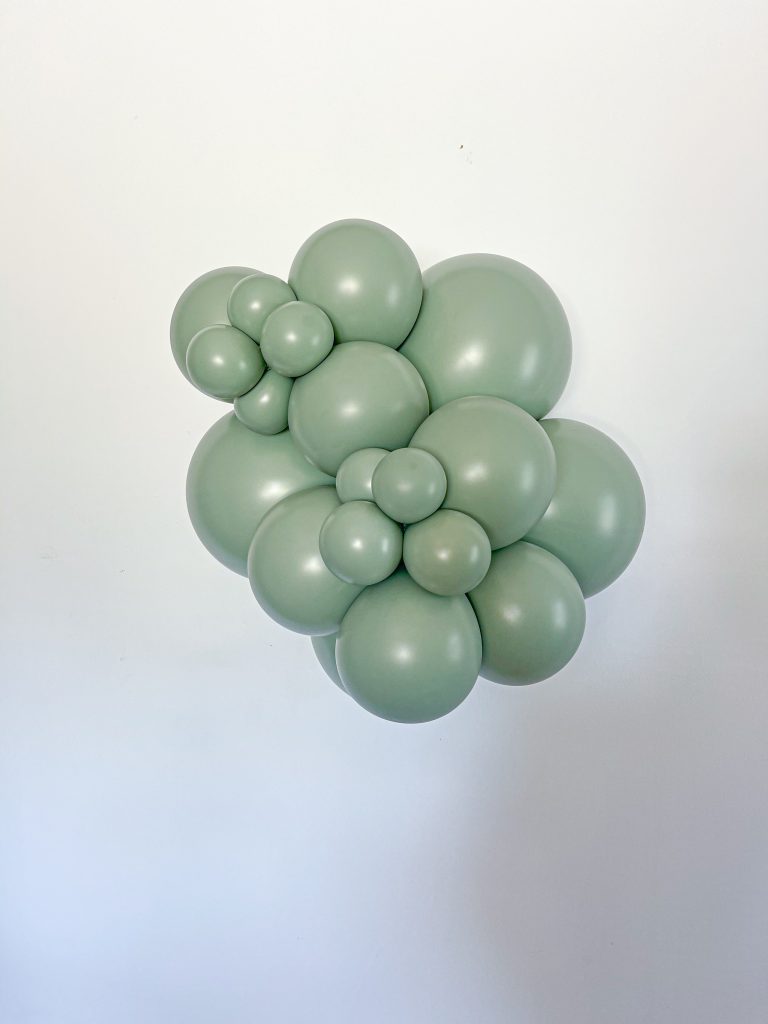 Tuftex Meadow latex balloon color cluster showing the shade across multiple balloon sizes