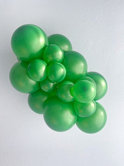 Tuftex Metallic Green latex balloon color cluster showing the shade across multiple balloon sizes