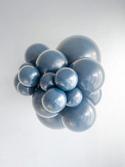 Tuftex Naval latex balloon color cluster showing the shade across multiple balloon sizes