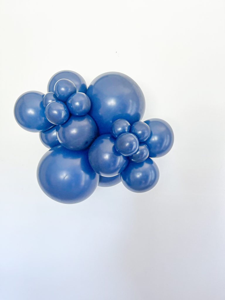 Tuftex Navy Blue latex balloon color cluster showing the shade across multiple balloon sizes