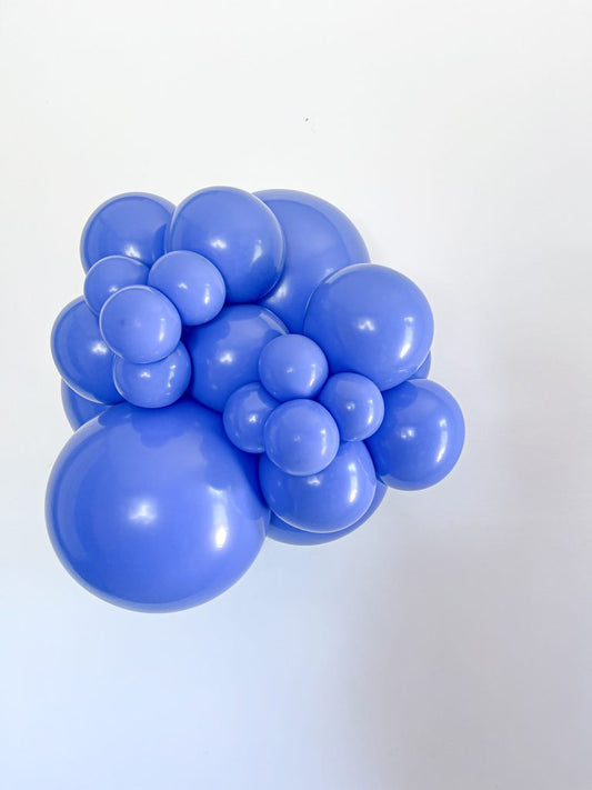Tuftex Peri latex balloon color cluster showing the shade across multiple balloon sizes