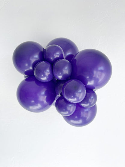 Tuftex Plum Purple latex balloon color cluster showing the shade across multiple balloon sizes