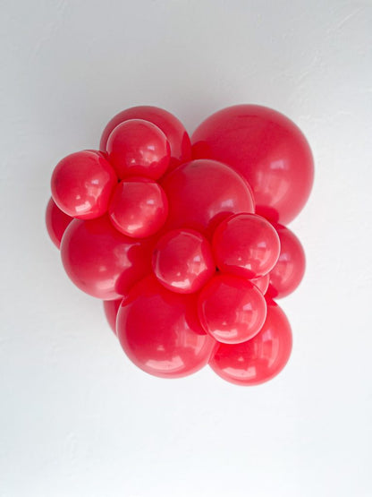 Tuftex Red latex balloon color cluster showing the shade across multiple balloon sizes