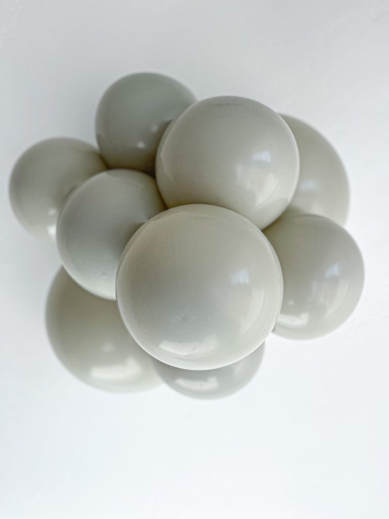 Tuftex Stone latex balloon color cluster showing the shade across multiple balloon sizes