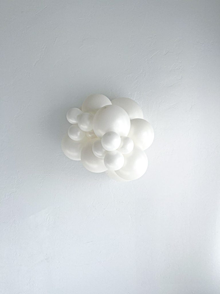 Tuftex Sugar latex balloon color cluster showing the shade across multiple balloon sizes