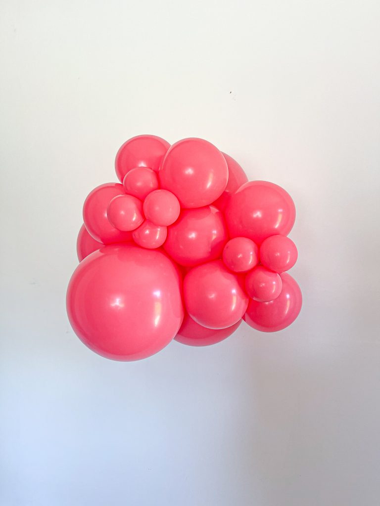 Tuftex Taffy latex balloon color cluster showing the shade across multiple balloon sizes