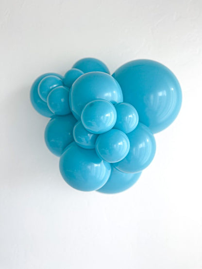 Tuftex Turquoise latex balloon color cluster showing the shade across multiple balloon sizes