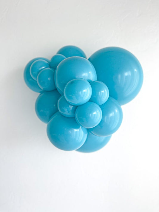Tuftex Turquoise latex balloon color cluster showing the shade across multiple balloon sizes