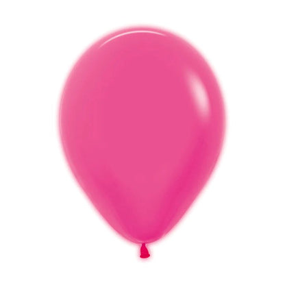 Glossy neon fuchsia latex balloon, 9-inch round shape, tied at the bottom.