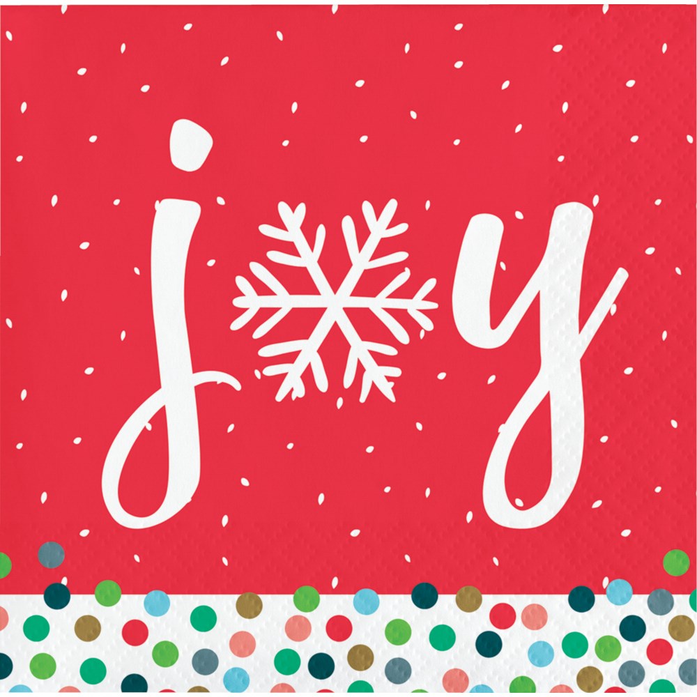 Red beverage napkin with white "joy" text, snowflake replacing the "o," and multicolored polka dot border.